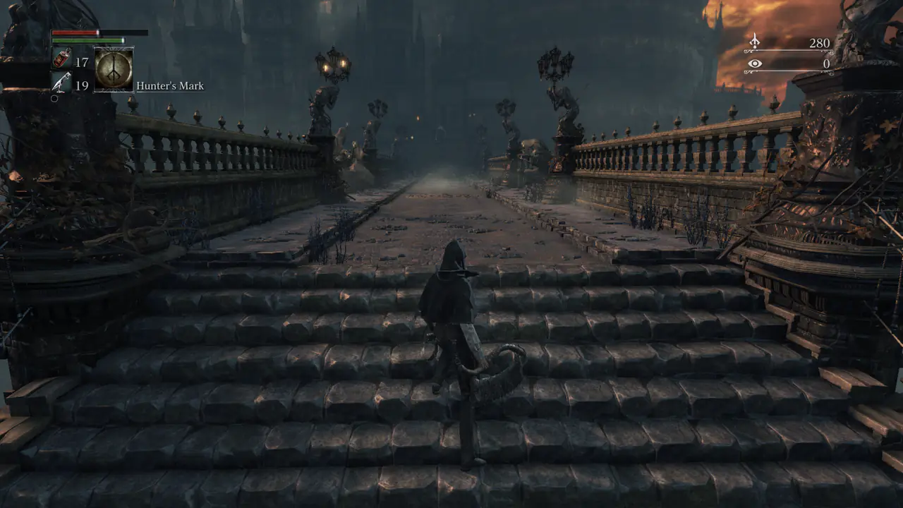 Bloodborne on the stone bridge in Yharnam with the wide field of view: balustrades, lamp posts and a burning sunset sky fill the frame, the hunter stands on the stairs.